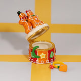 Gingerbread Couple Trinket Box shown open with the interior compartment visible and colorful props beside it