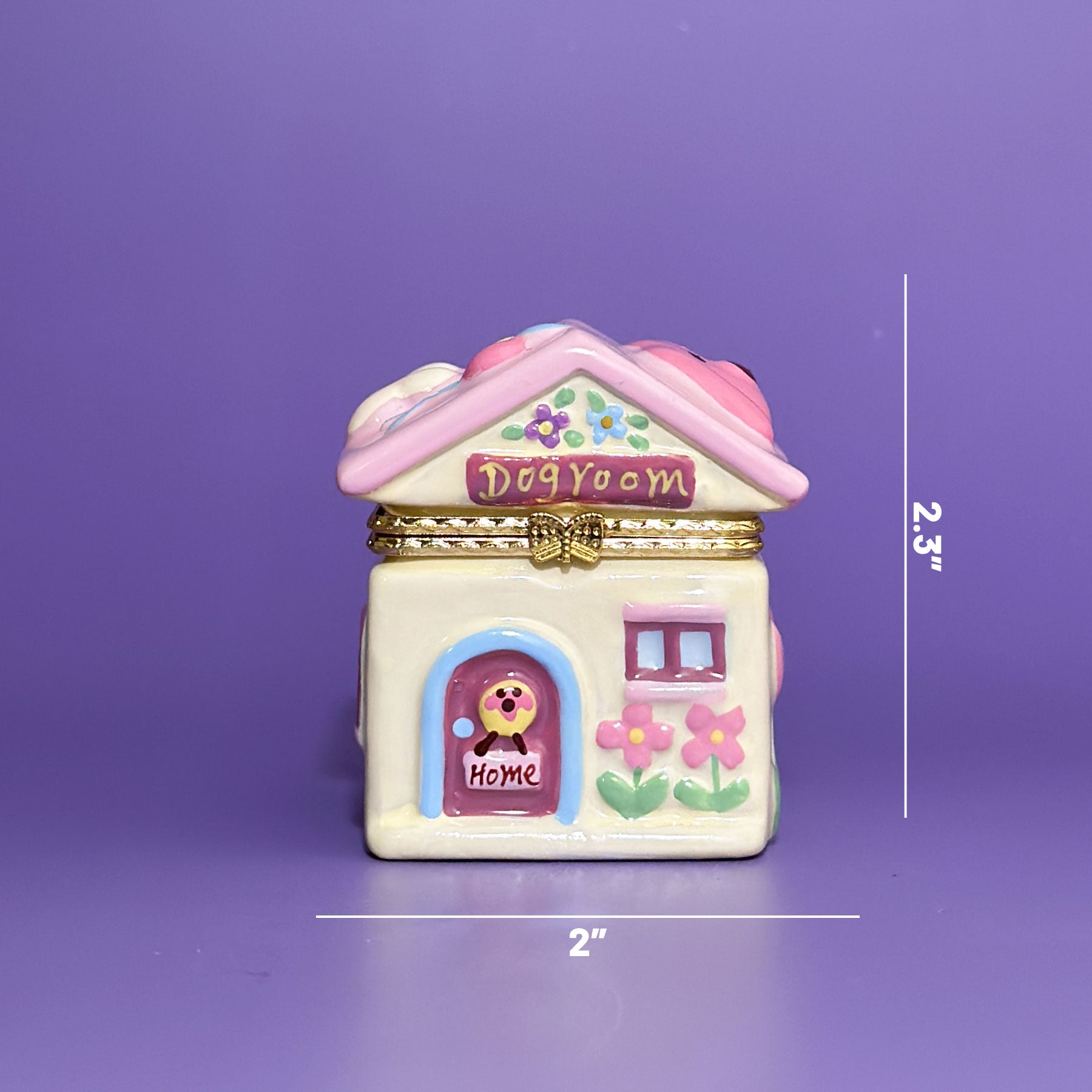 Measurement view of dog house trinket box showing 2-inch width and 2.3-inch height on purple background.