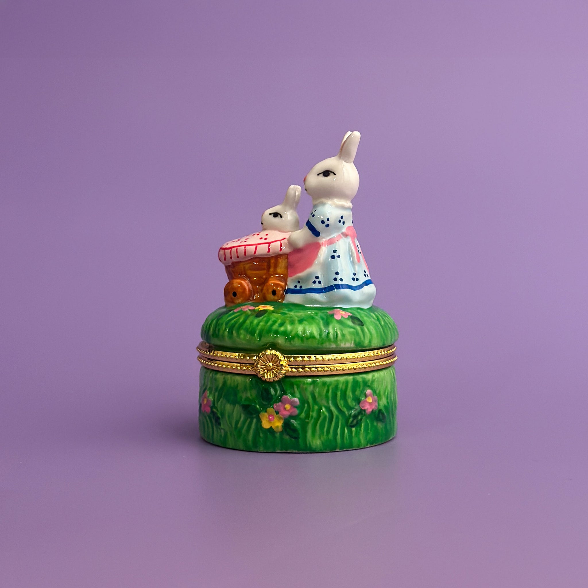 hand-painted ceramic bunny trinket box with spring picnic scene on purple background