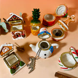 Hand-painted ceramic Winter Trinket Box Collection with lids open to show interior size and storage for rings, notes, or small keepsakes