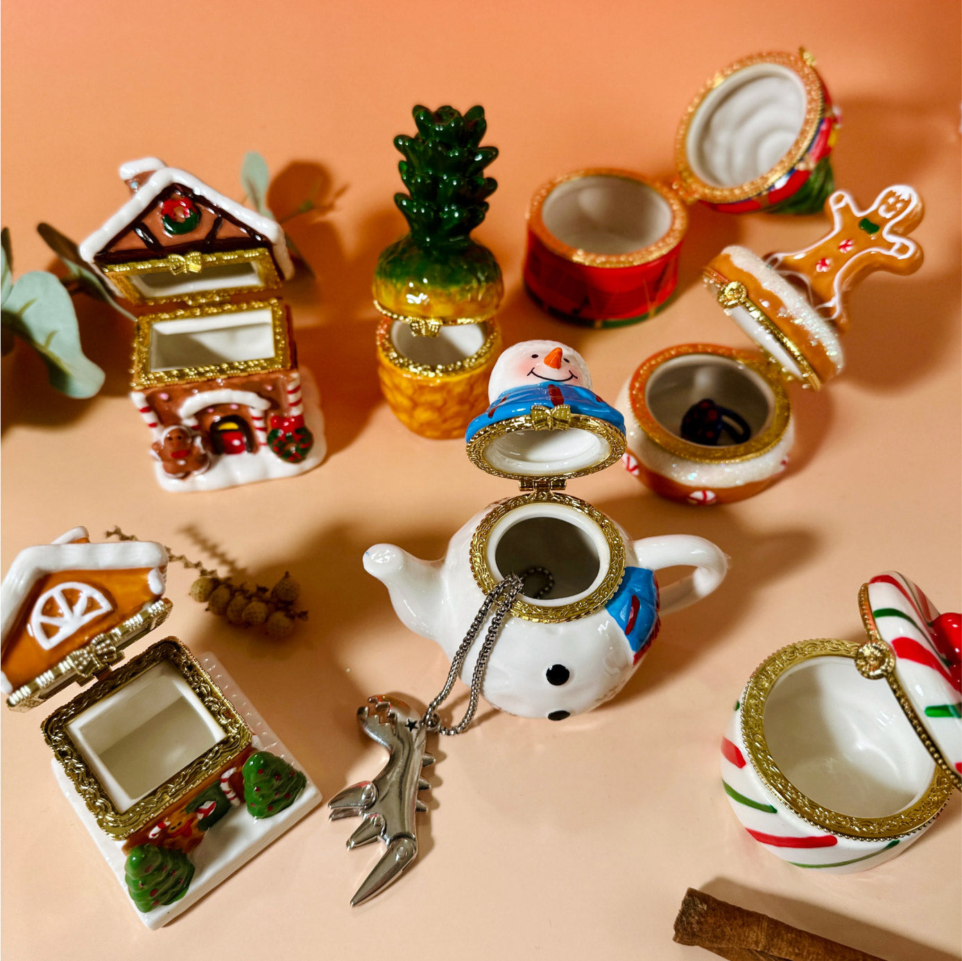 Hand-painted ceramic Winter Trinket Box Collection with lids open to show interior size and storage for rings, notes, or small keepsakes