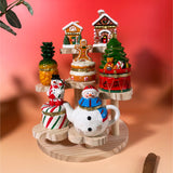 Hand-painted ceramic Winter Trinket Box Collection featuring 7 holiday designs: Gingerbread Houses, Pineapple, Snowmen, Christmas Tree with Bear, and Gingerbread on Cake.